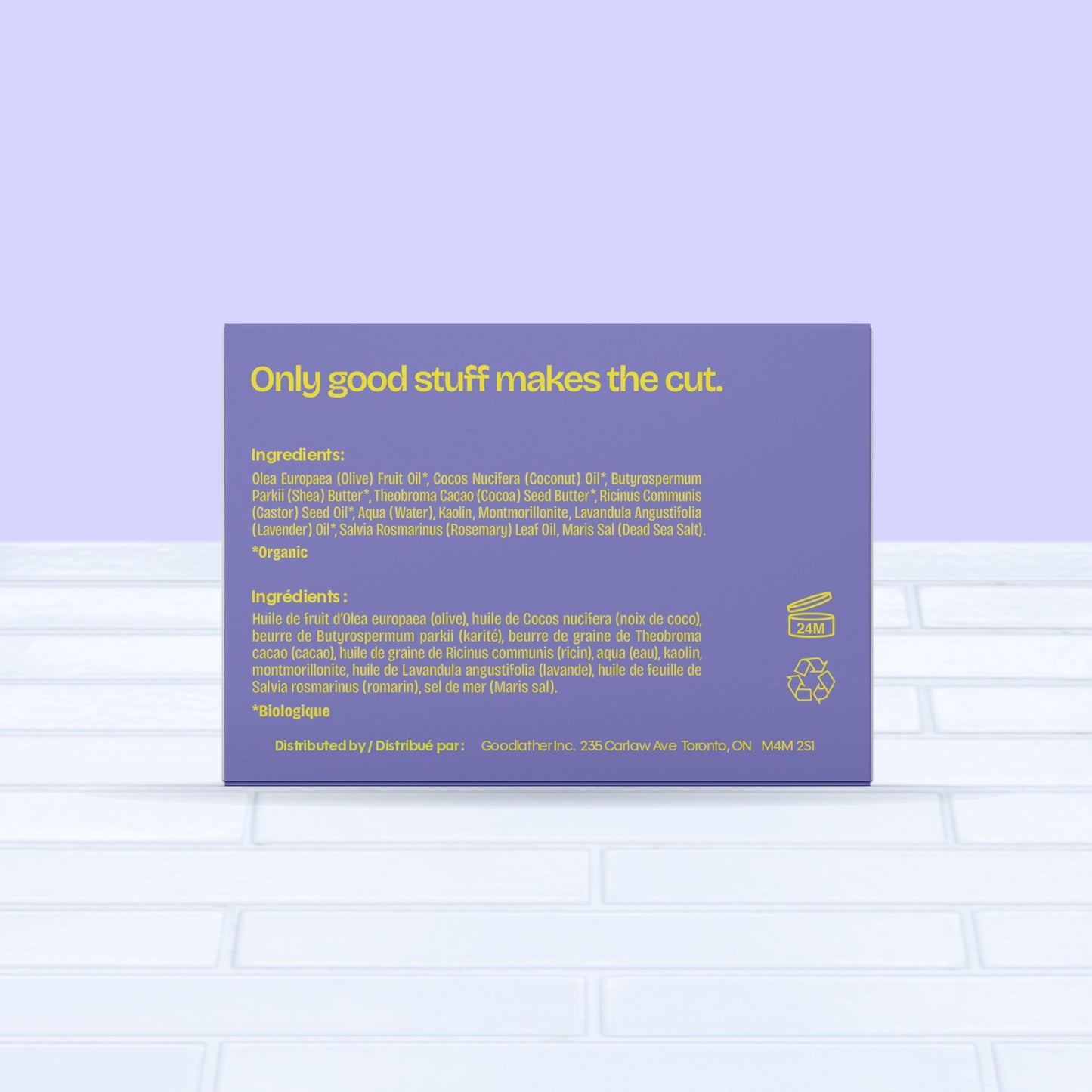 The purple and yellow label of Goodlather Lavender and Rosemary Bar Soap reads: Only good stuff makes the cut. Ingredients, distributor info (in English and French), and icons for organic, vegan, eco-friendly features appear on a pale purple background. Made in Canada.