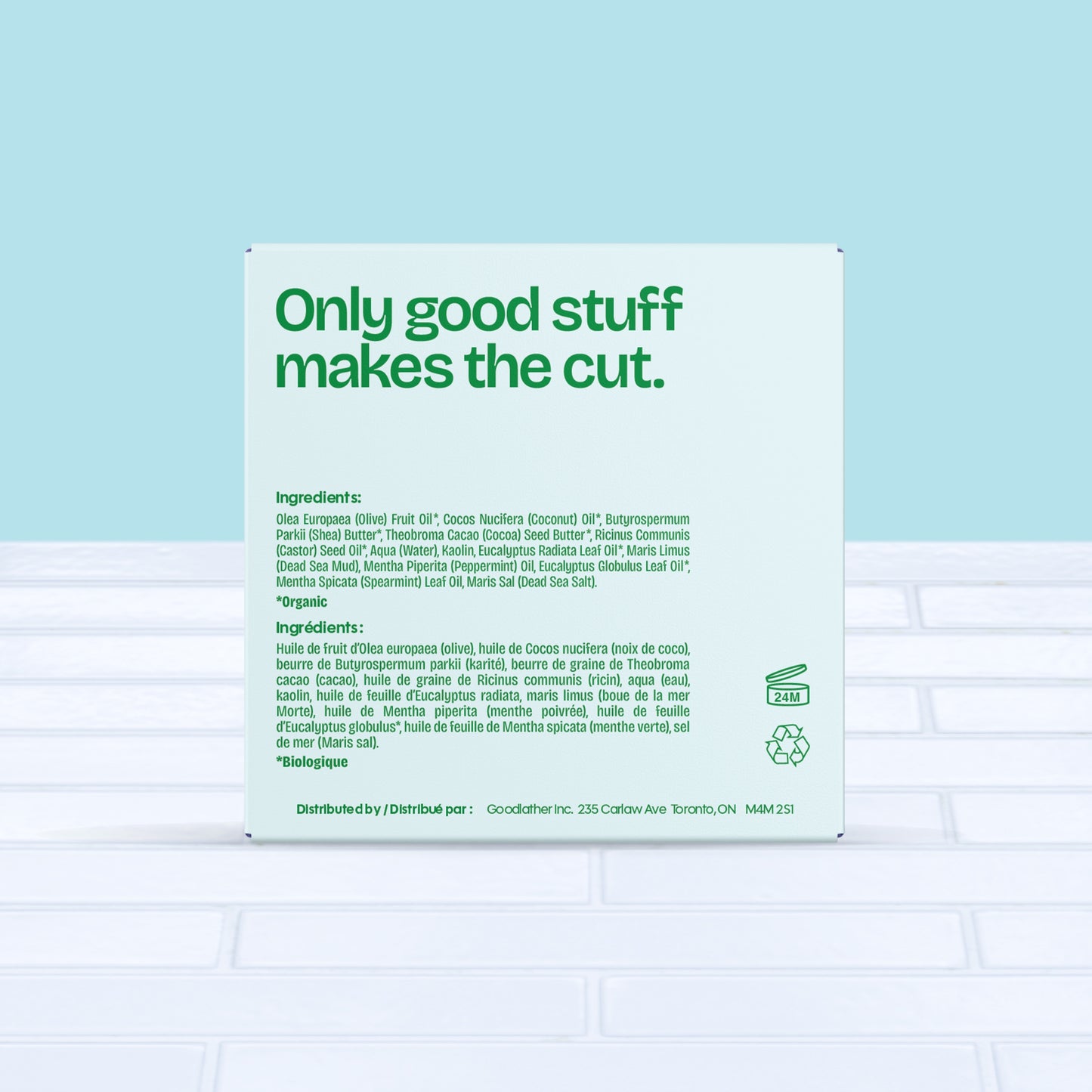 A Goodlather Eucalyptus Mint Bar Soap package features “Only good stuff makes the cut” above natural ingredients, “Biodegradable” label, and distribution info. Light blue and green tiles underscore its sustainable focus.