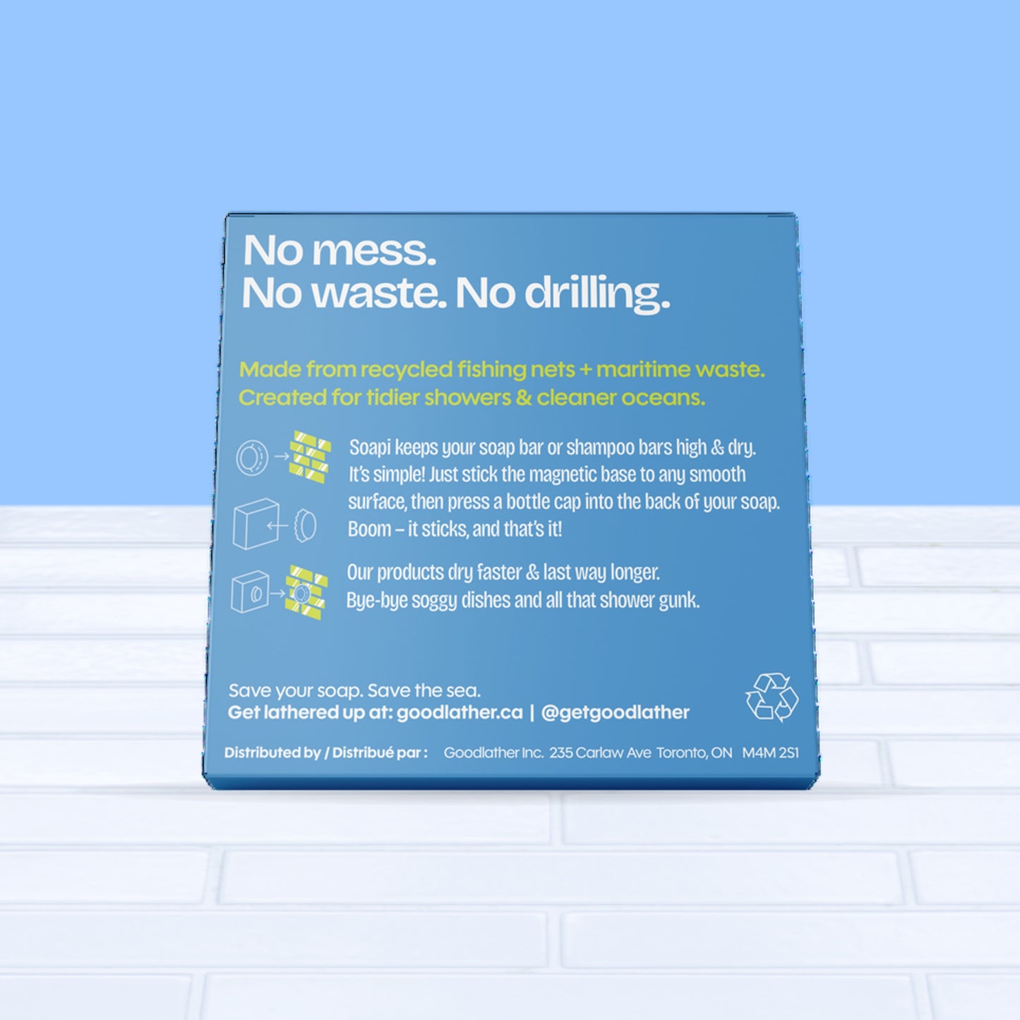 Our Soapi Magnet Holder box features details about this sustainable soap holder made from 95% maritime waste, designed for zero mess, waste, or drilling, shown against a light blue background. It's great for eco-friendly bathroom home owners and businesses alike. Product of Canada.